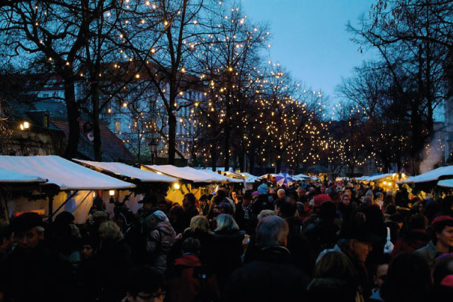 A crowd of visitors at the Alt-Rixdorfer Christmas Market in Berlin.