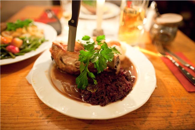 Plate of pork served with sauerkraut in the German restaurant Zur Letzte Instanz in Berlin.