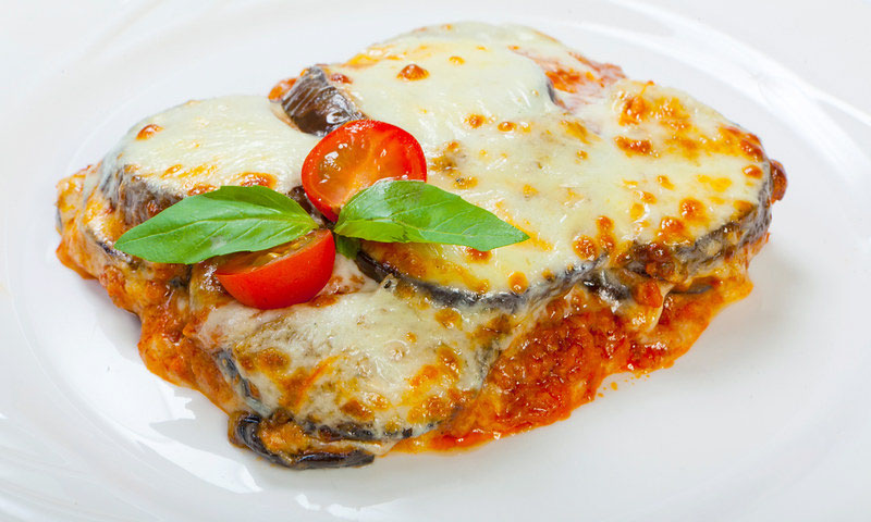 Vegetarian parmigiana on a white plate.
